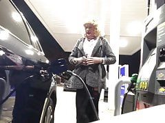 Cold night at the gas station in sexy midi-skirt and boots