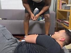 Black hunk using feet on a guy