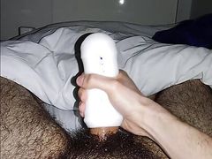Masked guy tries out a fleshlight for the first time