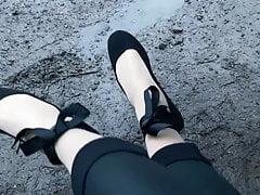 Crossdresser posing outdoor in leggings and nylons