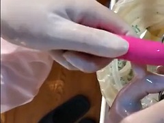Beautiful Female Surgeon With Surgical Gloves Fisting