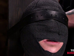 Masked BDSM babe tied up by master in his sex room