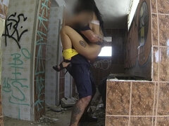 Black-haired slut gives head and gets fucked in some abandoned house