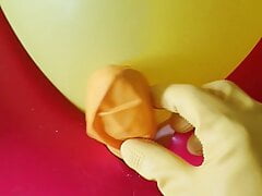 Rubberboy masturbates with rubber gloves and balloon