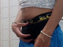 Guy gives himself a handjob in the bathroom with his big cock