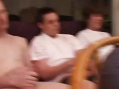At this house party, horny fucks jack off to the porn on TV