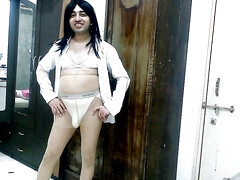 Sweet sissy crossdresser femboy Sweet Lollipop in a boyfriend shirt and pantyhose.