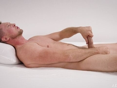 Naked Pierce Paris stroking on his back hardcore