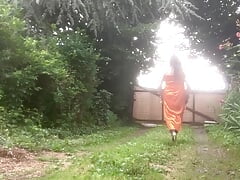 In orange dress outdoors