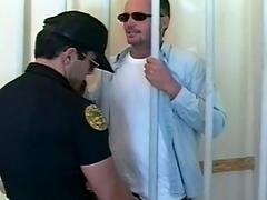 Cop and prisoner exchange blowjobs in the prison cell