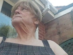 Betty Spanxxx shows off in a short dress during her outdoor solo adventure