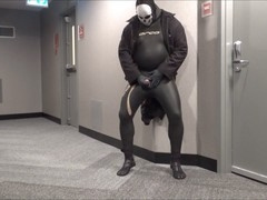 Jerking off in in hotel hall in wetsuit
