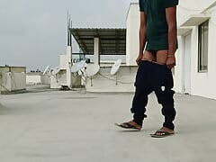 Getting naked in an open terrace and masturbating and cum