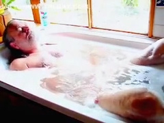 Mature man taking a bath