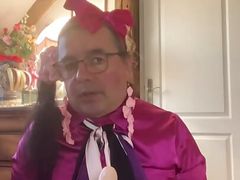 In an outfit with a little pink skirt to suck a dildo