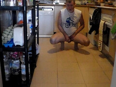 John is peeing on the kitchen floor