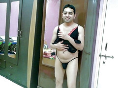 Hot sissy crossdresser femboy Sweet Lollipop in a black lingerie and thong.