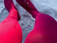 Crossdresser in pink pantyhose having fun in the snow