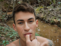 Passionate boys make out in the woods and share restless moments together