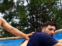 The pool boy and the curious fellow are doing it poolside