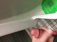 Public airport mens room jerking