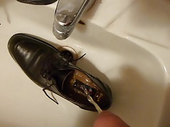 Piss in men's dress shoe