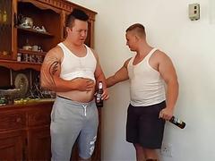Two chubby guys feed each other and worship their bellies