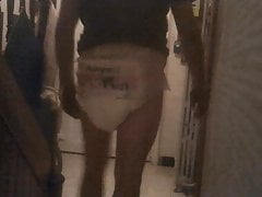 Baby takes out the trash in diaper