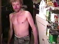 Redheaded older guy masturbates his massive cock in the kitchen