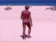 Tanned guy on beach in tiny string thong (temporarily!) 8