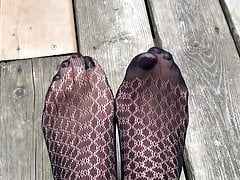 Sexy nylon feet with painted toes