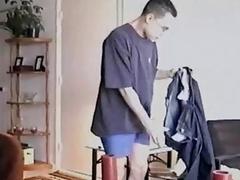 Geeky hunk lies back while his throbbing erection is sucked