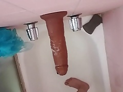 Big soapy dildo standing up