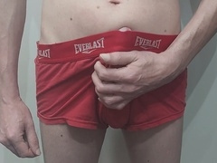Sexy guy strokes his big dick in red briefs, unleashing a massive load of jizz