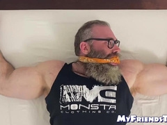 Bound bearded muscular hunk recives body and foot tickling