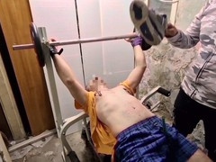 Gay men enjoy candle wax play at the gym and engage in a steamy game