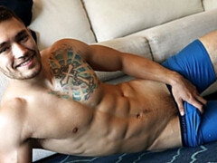 Tatted-up brunette guy Ricky Owen jerking his dick
