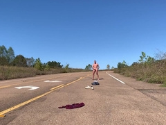 Unclothing nude on a public road and fapping off before getting clad again.
