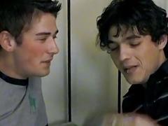 Gay twinks are smoking together as they give blowjobs to each other