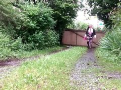 In a little floral skirt and fuchsia tie with stains in the garden for an evening