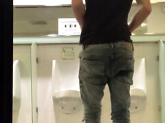 Wank in public toilet