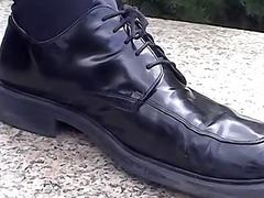Stud removes shoes and socks to show bare feet