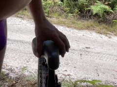 Bike railing and adventures in purple swimsuit