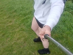 Crossdresser ambles in the rain in little micro-skirt