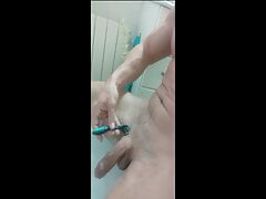 Davitete69 shaving his cock.