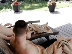 Ginger cutie is giving a blowjob in the summer garden