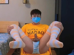 Guy in yellow t-t-shirt and stocking drains and pops at home