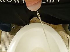 Russian man playing and pissing on the couch