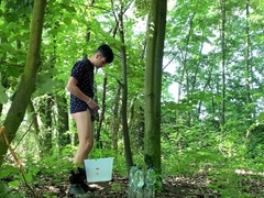 Testicles spreading outdoor with bucket packed with water and masturbate off