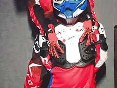 A guy in a motocross gear gets a portion on his mxhelmet